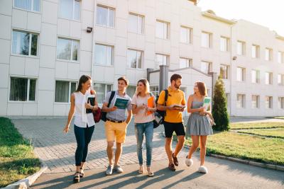 free-time-of-students-bachelor-s-campus-life-rhythm-five-friendly-students-are-walking