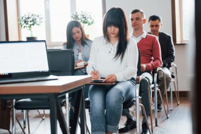 group-of-people-at-business-conference-in-modern-classroom-at-daytime